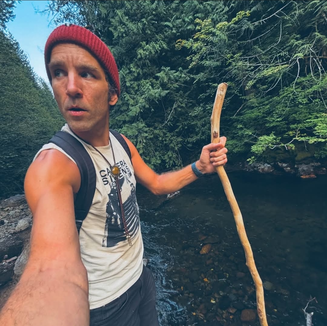 Rockhound exploring a Pacific Northwest river