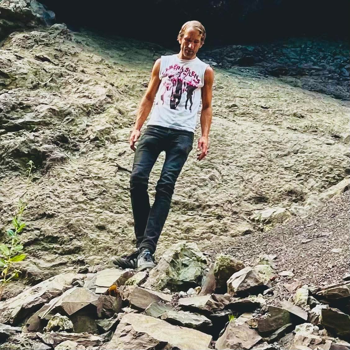 Peter Herres searching exposed rock in the field
